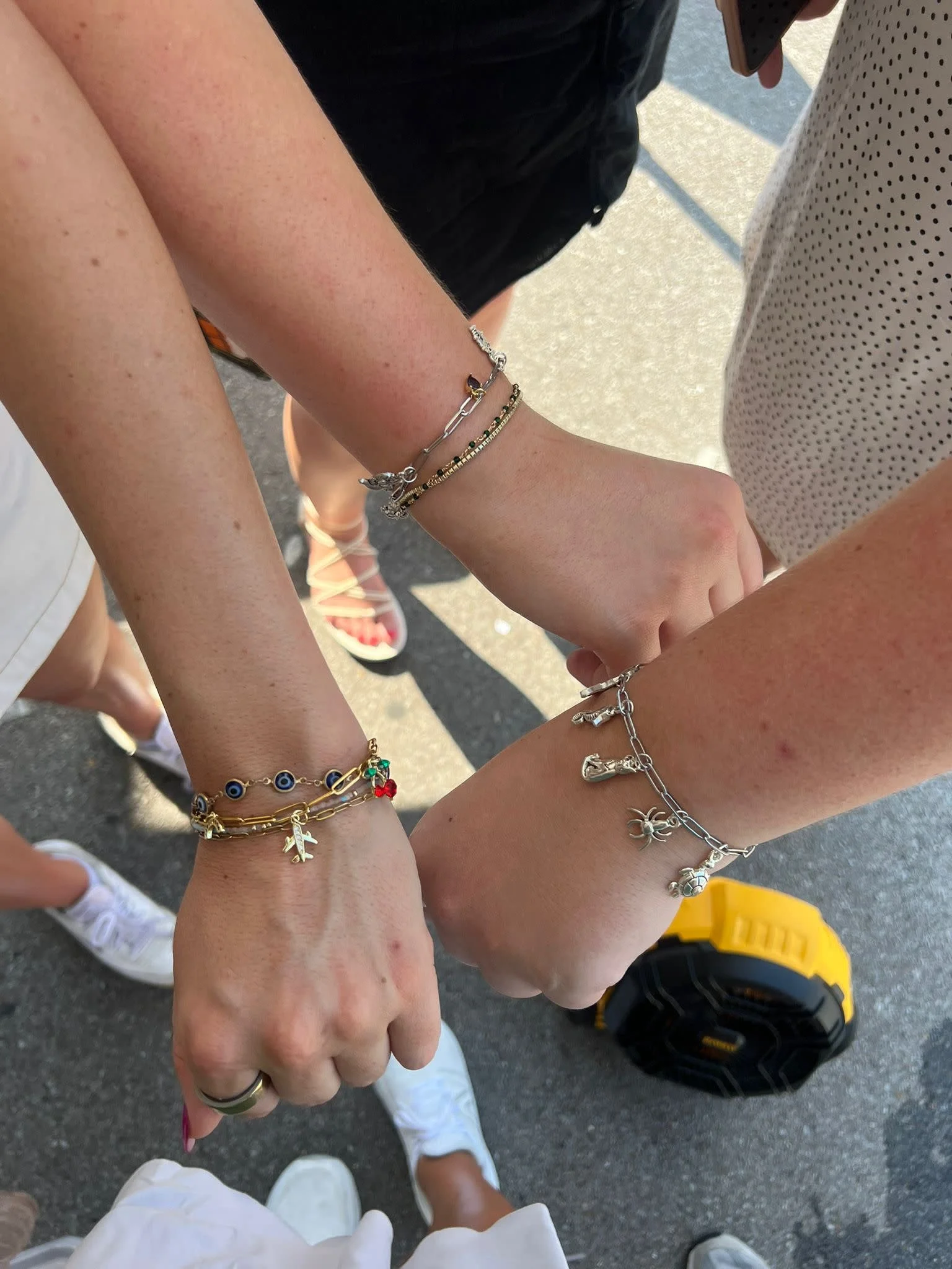 girls arms with permanent jewelry on them during a bachelorette weekend