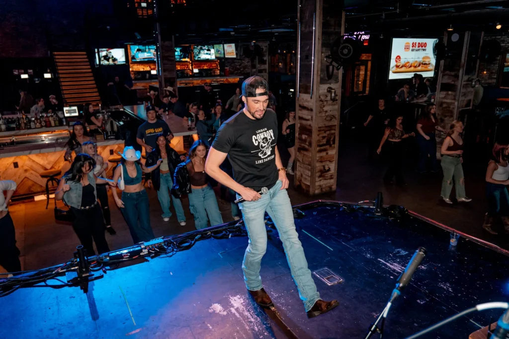 men teaching a line dancing class to bachelorettes in nashville