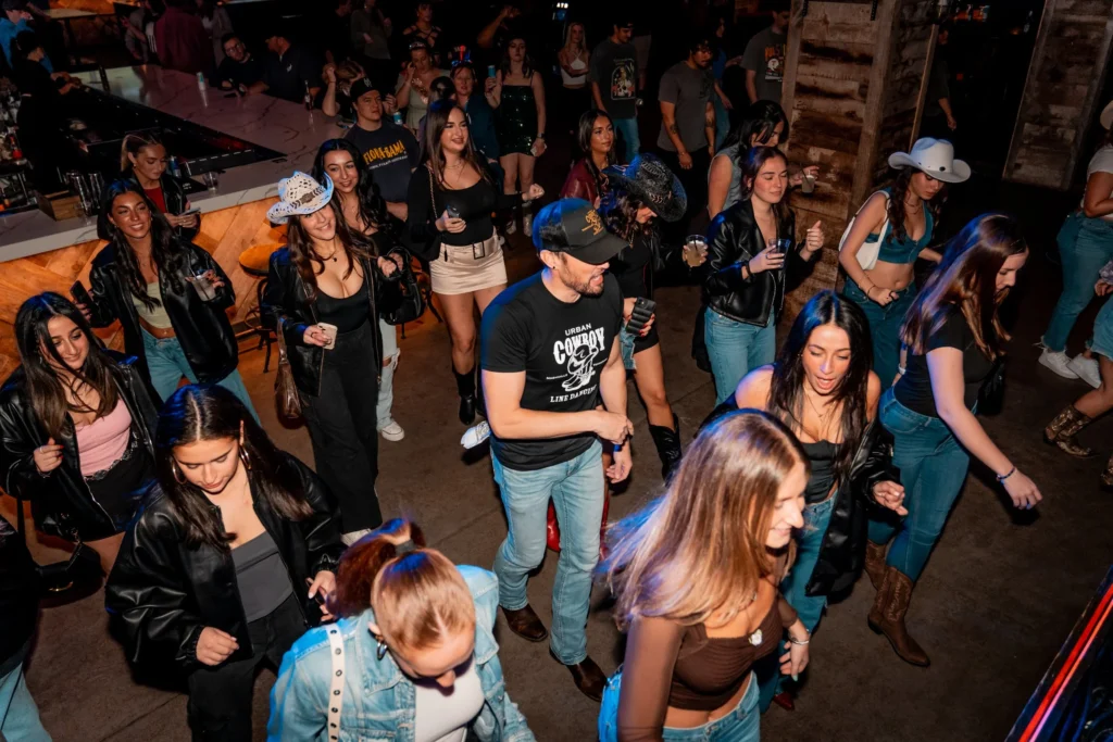 men teaching a line dancing class to bachelorettes in nashville
