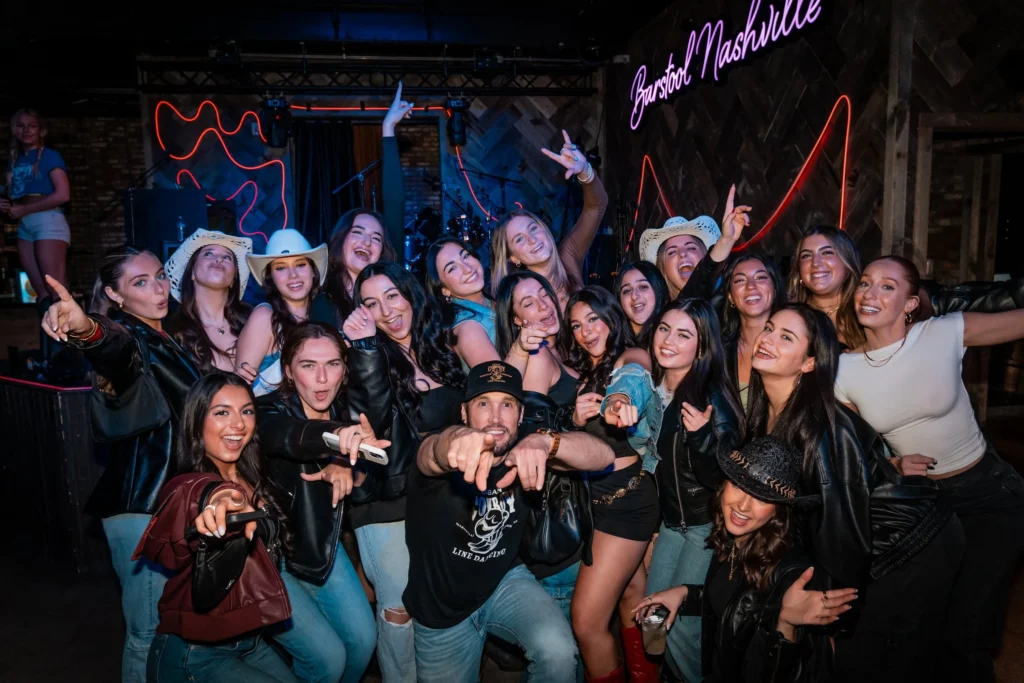 men teaching a line dancing class to bachelorettes in nashville