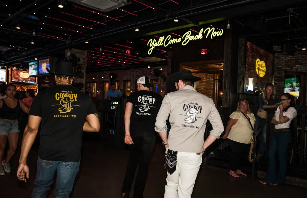 men teaching a line dancing class to bachelorettes in nashville