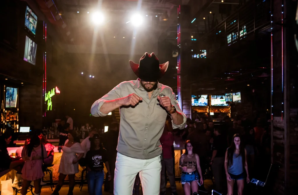 men teaching a line dancing class to bachelorettes in nashville