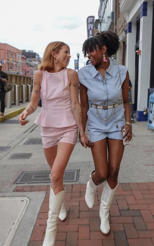 bachelorette girls on broadway wearing cowgirl hats and wearing Molly Green clothes