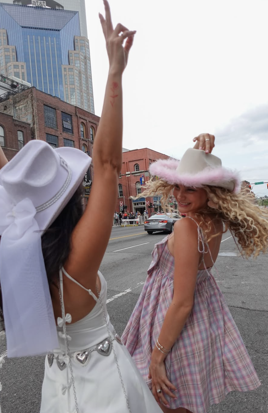 bachelorette girls on broadway wearing cowgirl hats and wearing Molly Green clothes