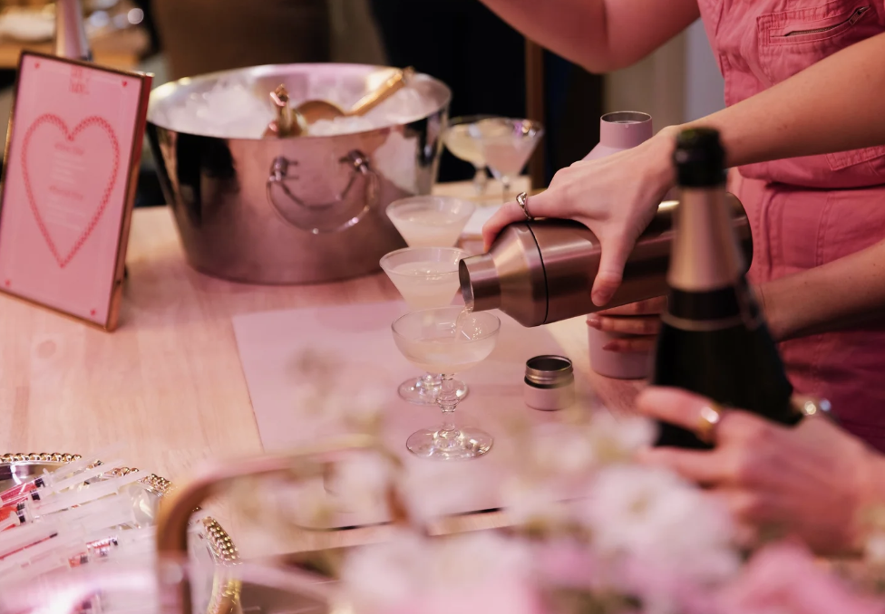 hand holding martini at bachelorette party during cocktail making class