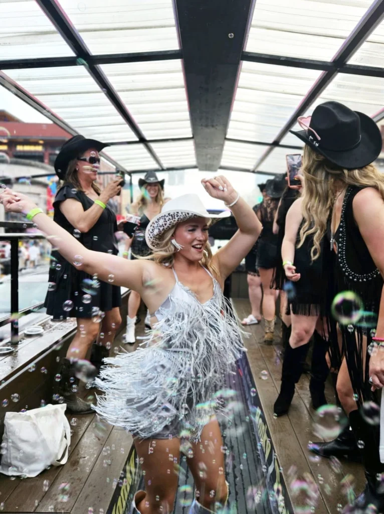girl dancing on a party bus going down broadway in nashville