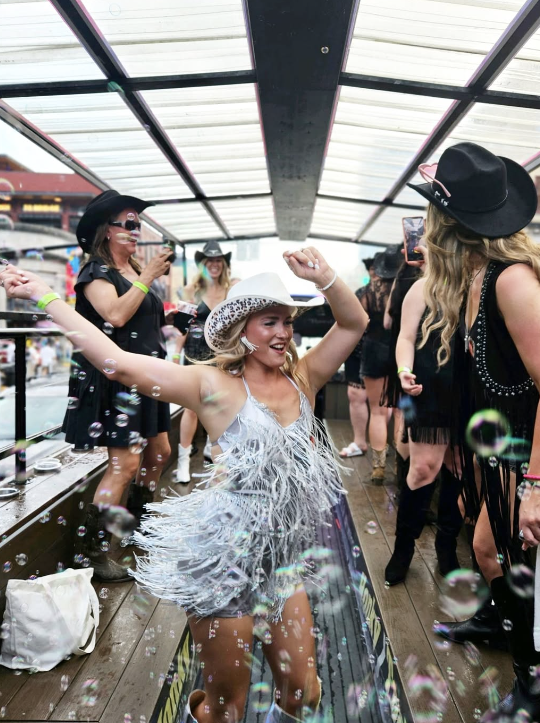 girl dancing on a party bus going down broadway in nashville