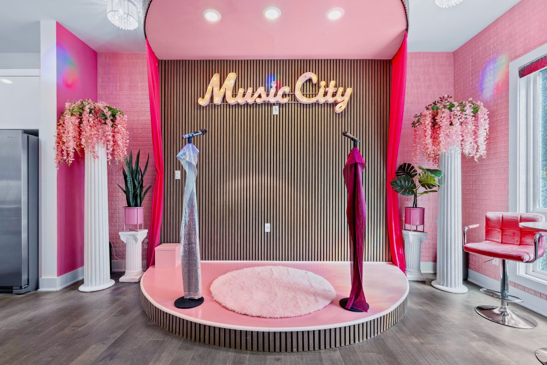pink nashville airbnb with a stage