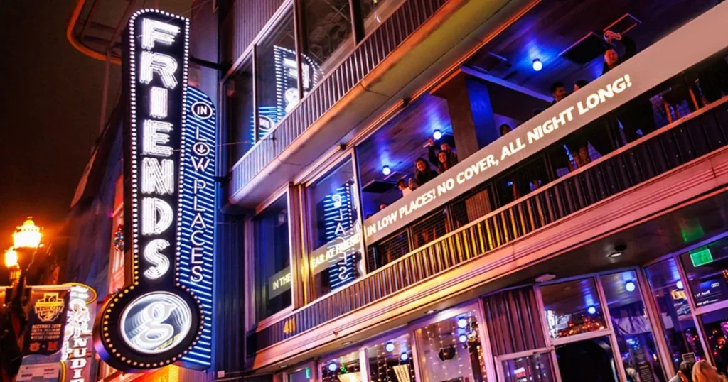 friends in low places bar on broadway in nashville lit up at night