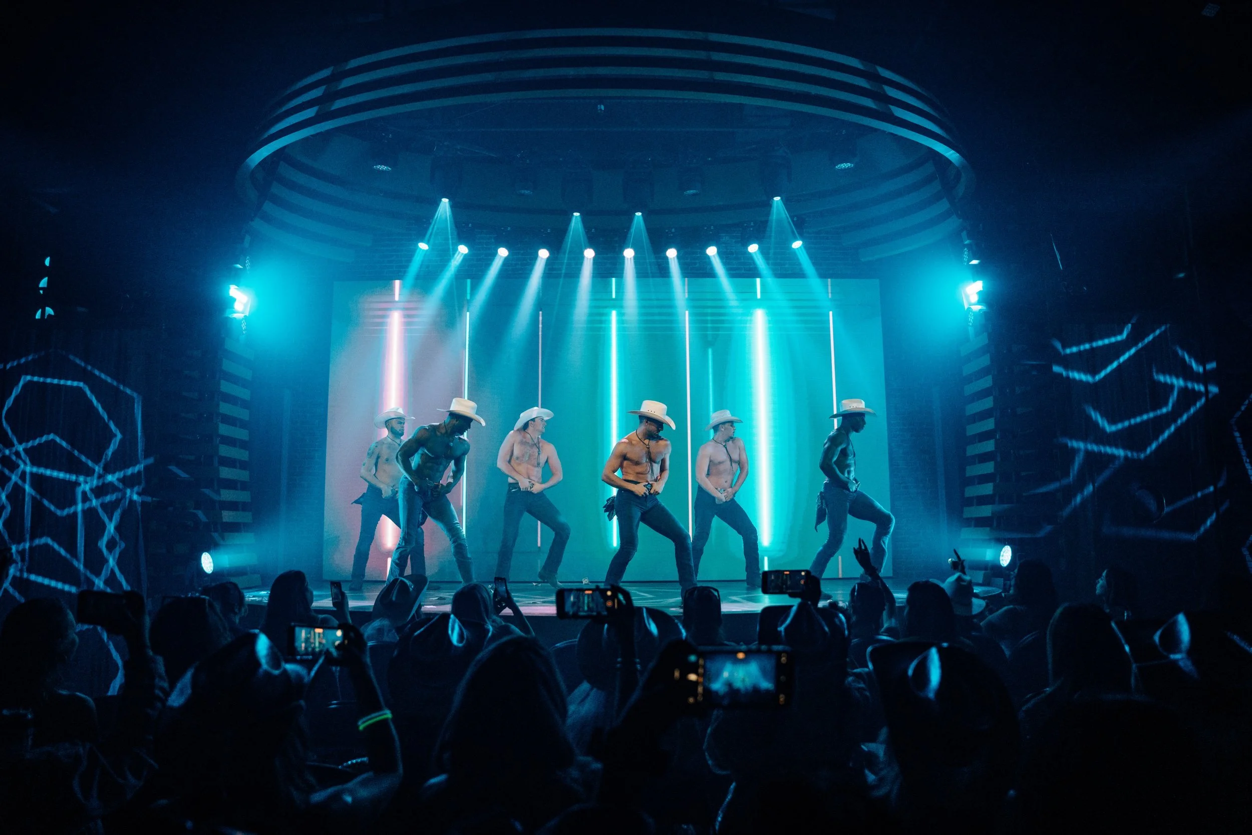 shirtless cowboys on stage dancing for bachelorette party in nashville