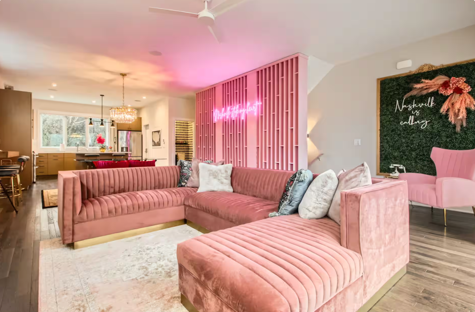 bachelorette airbnb in nashville in all pink, neon signs and disco balls