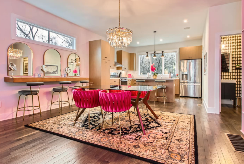 bachelorette airbnb in nashville in all pink, neon signs and disco balls